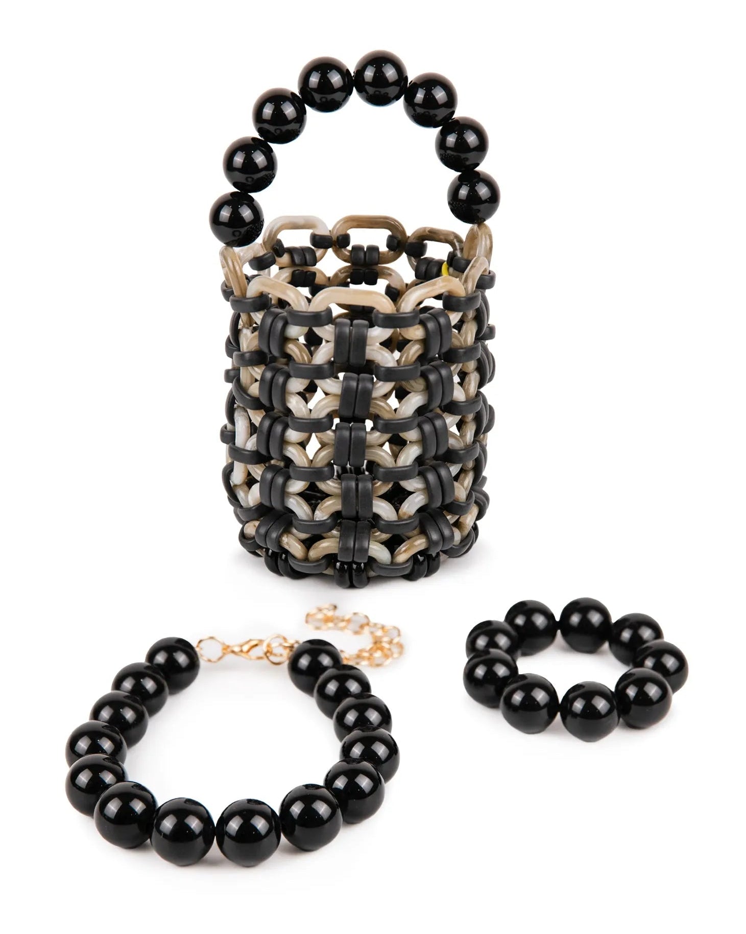 collana e bracciale perle grandi in resina nera e borsa in resina