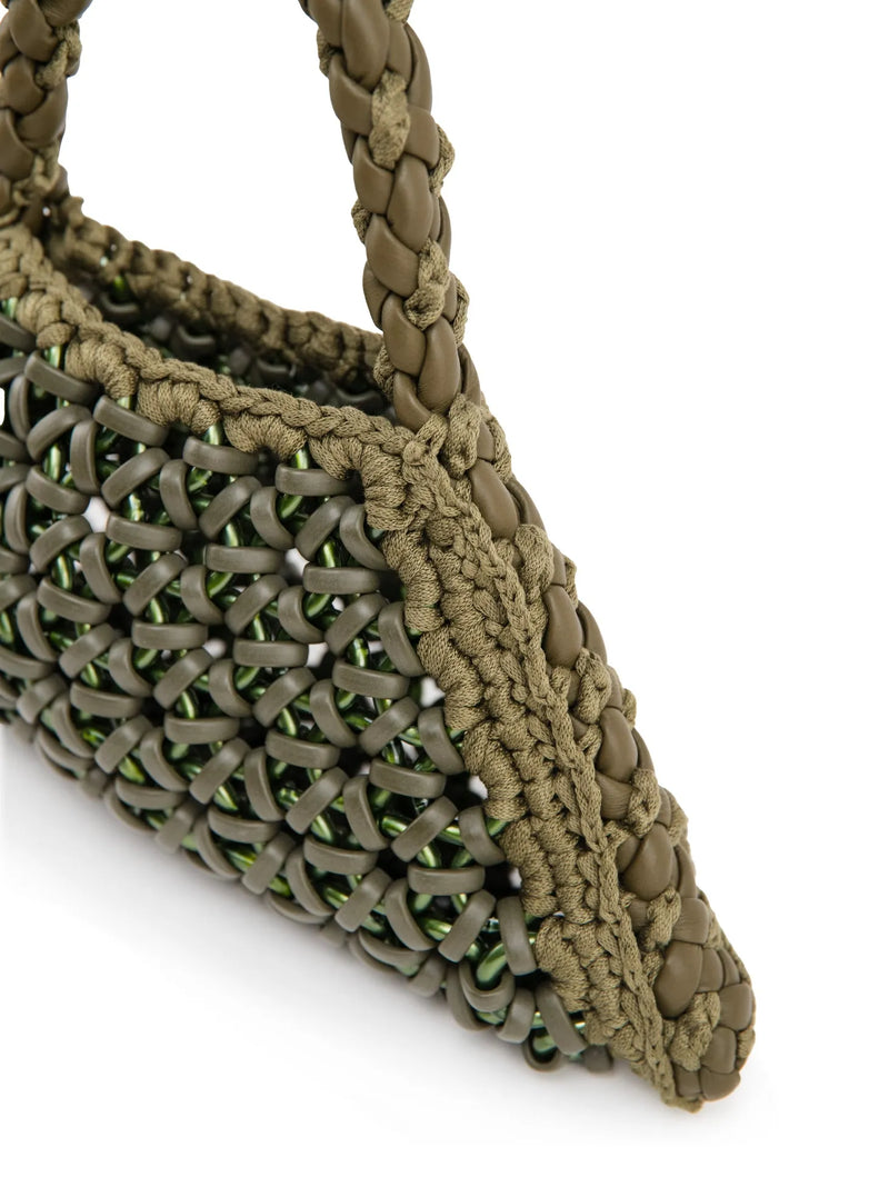 dettaglio borsa a mano in resina, pelle e cotone verde militare
